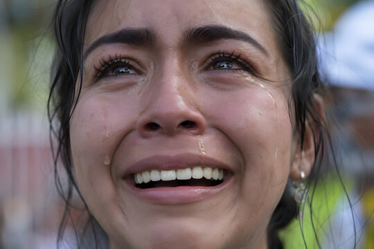Extreme close-up portrait of emotional catharsis with tears of joy, relief, gratitude and awe. Hyperrealistic skin texture, powerful human expression, cinematic shallow depth of field.
