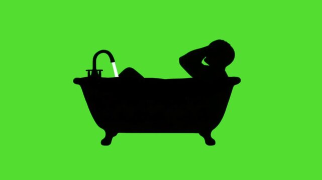 silhouette of a man relaxing and taking a bath in a vintage bathtub on a green screen