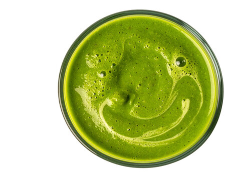 Fresh green vegetable smoothie in glass top view showing vibrant colors and healthy detox drink texture