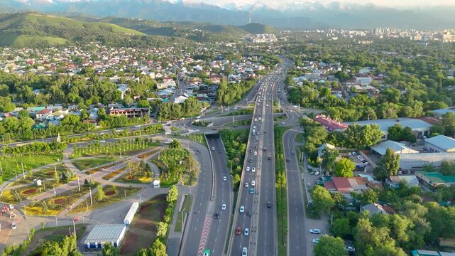 ALMATY, KAZAKHSTAN &ndash; MAY 25, 2026: Aerial view of the Eastern Bypass Road (EBYR)-Kulja Highway with traffic and the Halyk Arena sports complex