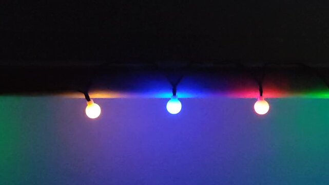 Modern interior with decorative string lights and glowing bulb spheres enhancing a calm mood.
