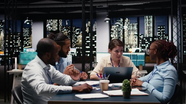 Diverse team sharing a high five and celebrating accomplishment in office together, dream team ensures efficient collaboration and problem-solving concept. Experts uniting forces for tasks.