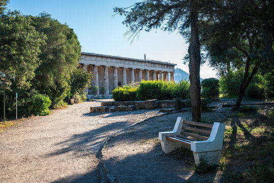 Approaching the Temple of Hephaestus through the Ancient Agora of Athens on a bright May morning under clear Mediterranean skies.