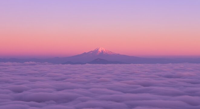 Snow covered mountain peak rising above cloud cover during sunset. Panoramic view of rocky summit with pink sky glow. Concept of altitude, freedom, tranquility and mountain exploration.