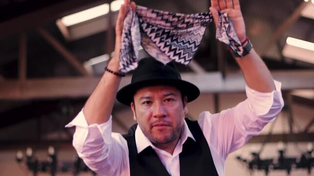 Adult man in formal attire dancing gracefully and moving. Cueca brava, a traditional Chilean dance, representing Chilean identity. National holidays.