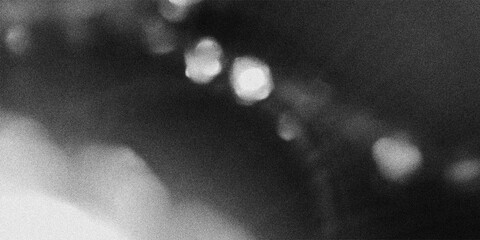 Abstract grainy background texture with blurry lights, bokeh and lens flares © Santy Valdes