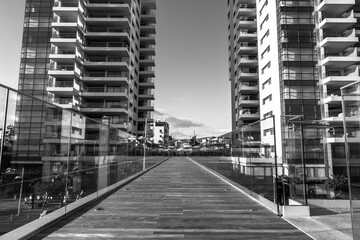 Symmetrical Wooden Promenade Between Modern Glass Towers, Funchal Marina, Madeira, Portugal © djem79