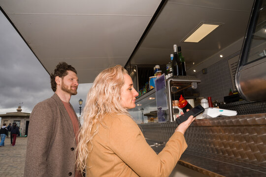 Couple Ordering Food at a Food Truck in Liverpool