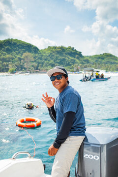 Portrait of a smiling skipper on a boat