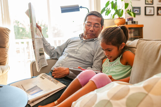 Reading newspaper Grandpa and Grandchild