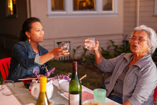 Adult daughter Senior Mother Drinks 