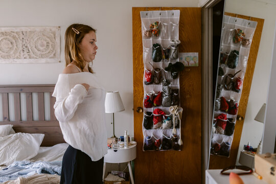 Getting Dressed in Her Bedroom