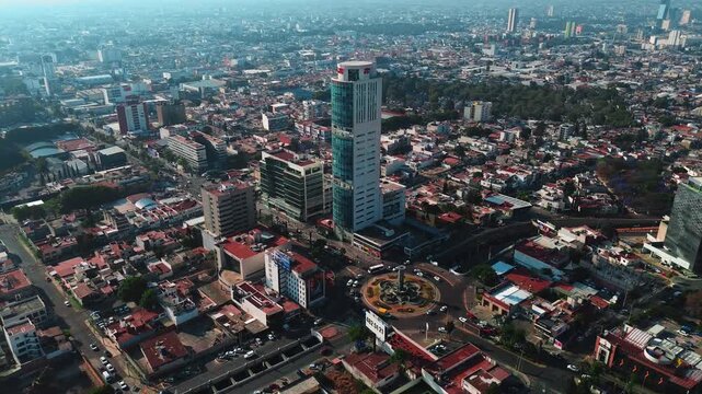Puebla Corporate JV Building on Juarez Avenue with Panoramic Cityscape View at Sunrise Rotation Camera Movement Aerial Drone POV 4K 29fps Editorial Video Asset