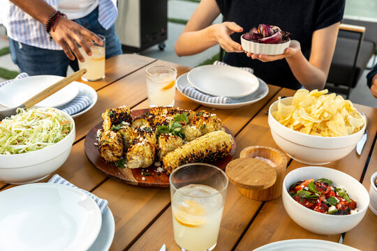 Passing Food at a Backyard BBQ