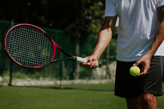 Playing tennis at a sunny outdoor court in Tulum, Mexico