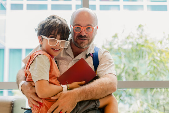 Father Embrace Son Hospital Waiting