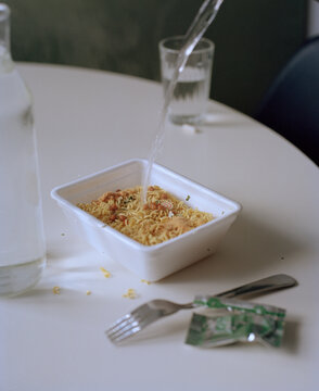 Instant noodles on the kitchen table, modern still life