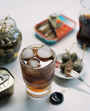 Some canned food, anchovies and sparkling water.
