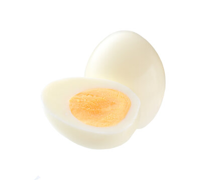 Single whole boiled egg with halved egg isolated on a white background.