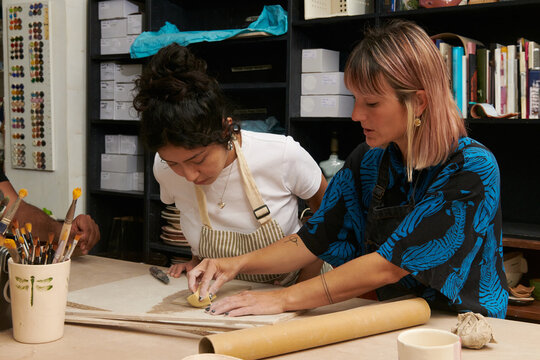 Ceramist students at pottery studio