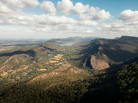 Expansive view of a mountain range with lush greenery