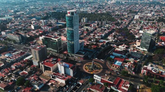 Puebla Corporate JV Building on Juarez Avenue with Panoramic Cityscape View at Sunrise Rotation Camera Movement Aerial Drone POV 4K 29fps Editorial Video Asset