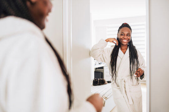 Home photo of happy african american woman after beauty routine