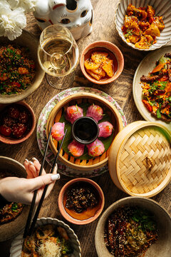 Asian fusion meal with purple dumplings and assorted dishes