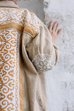 Closeup of Design elements of a handwoven garment on a person
