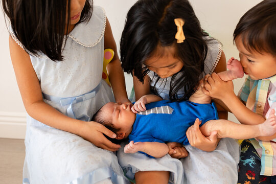 Siblings with new baby