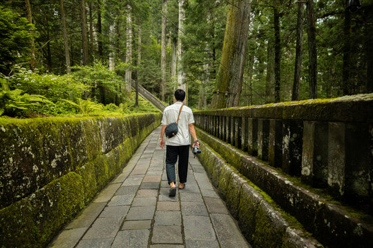 Tourist walking to Okumiya Haiden