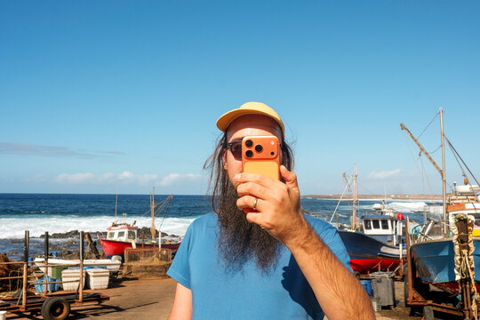 Traveler Taking Selfie by Harbor