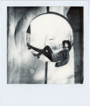 Female Figure in Circular Frame