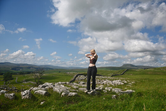 A teenage girl poses in the English Countryside