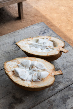 Open exotic fruit halves revealing soft pulp inside