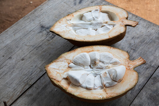 Halved exotic fruit displaying creamy white sections