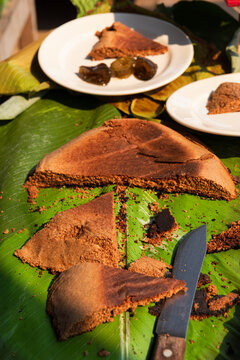 Traditional baked goods on banana leaves display