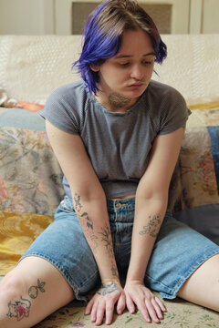 Portrait of an alternative young adult at their home