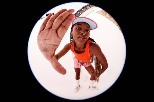Woman Reaching Toward Camera Fisheye Portrait