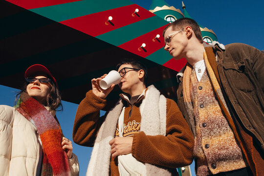 Friends enjoy a sunny winter day together with laughter outdoors