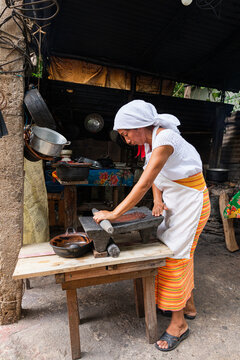 Close-up of grinding process in a rustic kitchen in Mexico