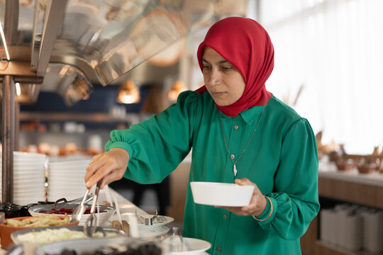 Woman at Food Service Station