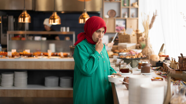 Woman choosing food at Buffet
