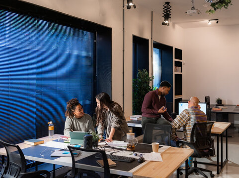 Diverse people working at modern corporate office 