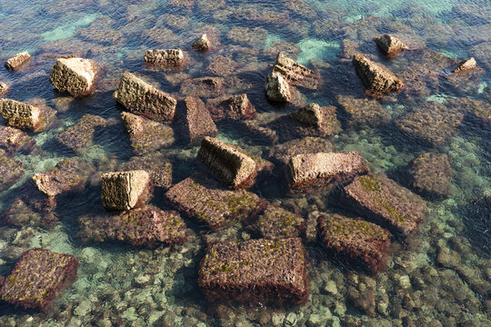 Ancient Stone Blocks Under Clear Water
