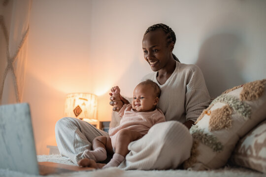 Mother enjoying video call with her baby 