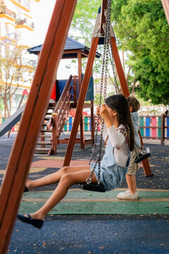 Kids swinging at playground
