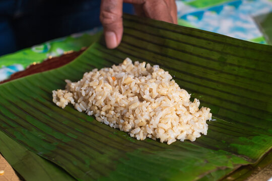 Rice is Placed on a Banana Leaf for Serving in a Traditional Meal