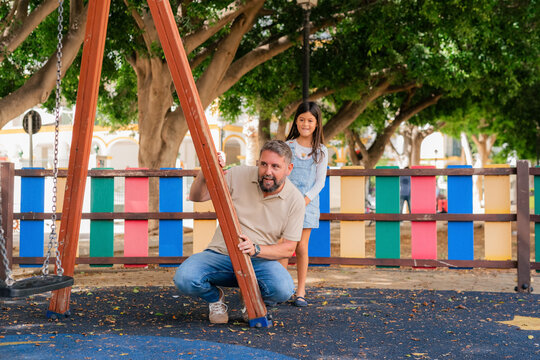 Father and daughter playing hide and seek 