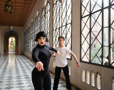 Woman dancing with man during rehearsal